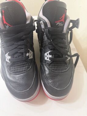 Nike Black and Red Air Jordan 4 Retro Sneakers